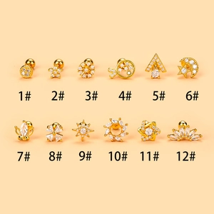 Detailed set of 12 gold plated stainless steel stud earrings with cubic zirconia designs
