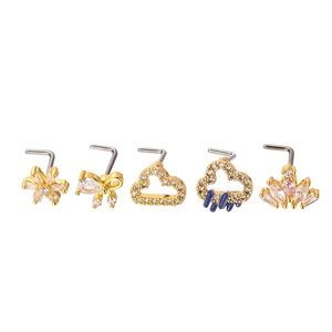 Five-piece gold L-shaped nose stud set with cubic zirconia butterfly and flower designs