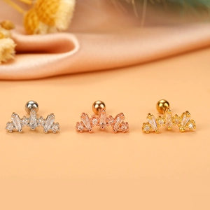 Detailed view of flower-shaped zirconia ear studs in silver, gold, and rose gold finishes