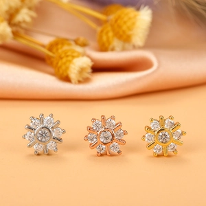 Detailed view of three sunflower zircon ear studs in silver, rose gold, and gold finishes