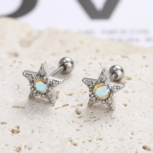 Detailed macro view of star stud earring with purple AB zircon and screw ball back