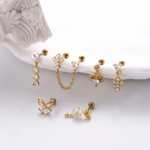 7-piece set of gold stainless steel cross and butterfly earrings with cubic zirconia studs