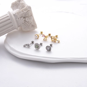 Set of 6 gold and silver zircon bow knot drop stud earrings on white display stands