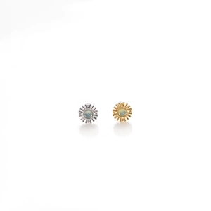 Elegant gold and silver sunburst stud earrings featuring opal center stones on white base