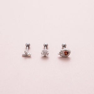 Detail of silver butterfly, snowflake and red heart stud earrings with screw ball backs