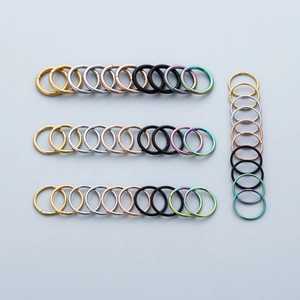 Surgical stainless steel hoop rings in various colors for nose and lip piercings