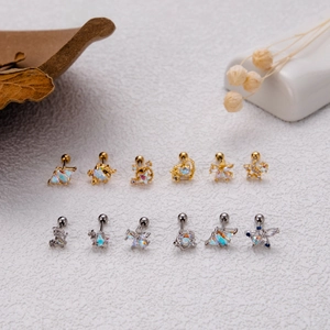 Detail showing titanium steel cartilage studs collection with opal and zircon inlays