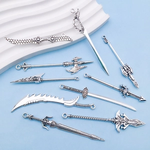 Detailed view of antique silver alloy sword pendants with intricate fantasy weapon designs