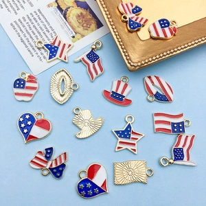 Flat lay of diverse American flag themed enamel charms for DIY jewelry making
