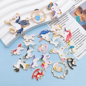 Detail of colorful unicorn alloy pendants with gold-plated edges for DIY jewelry making