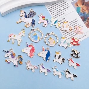Detailed macro view showing a collection of colorful mixed enamel unicorn alloy charms