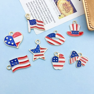 Detailed macro of patriotic US flag themed enamel charms for DIY jewelry making and crafts