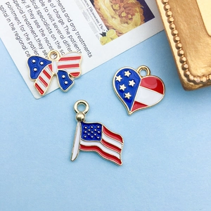 Macro shot of USA flag enamel charms in heart, bow, and flag shapes for jewelry DIY