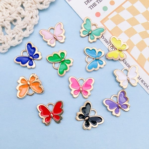Close-up of colorful butterfly alloy charms with enamel finish for DIY jewelry making
