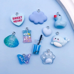 Blue resin charm set including heart, duck, and cloud pendants for DIY jewelry making