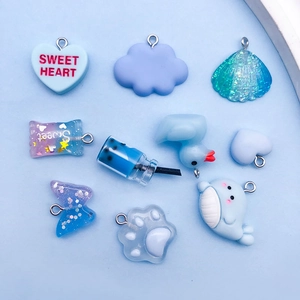 DIY blue resin charms set featuring hearts and animals with metal loops for jewelry making