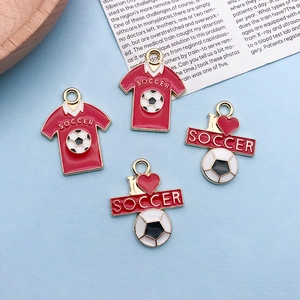 Detail view of red soccer jersey and I love soccer enamel charms with gold metal edges