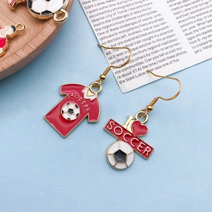Detailed close-up of soccer jersey and I love soccer charms on gold alloy earrings