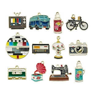 Set of 12 vintage style enamel alloy charms including retro TV sewing machine and radio