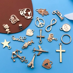 Rose gold alloy charms collection featuring heart, cross, and Eiffel tower for DIY jewelry