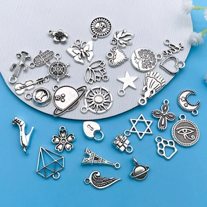 Detailed collection of vintage silver charms for DIY jewelry making and necklace crafts