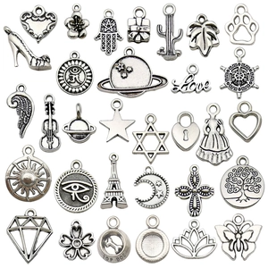 Set of 30 vintage Tibetan silver alloy charms for DIY bracelets and necklaces with varied motifs