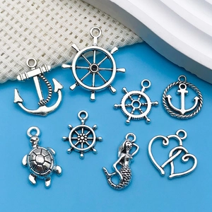 Detailed set of antique silver nautical alloy charms including anchors and mermaids for DIY