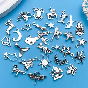 Variety of antique silver alloy charms including animals and sun shapes for DIY jewelry
