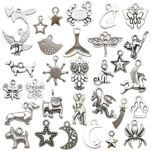 Antique silver alloy charms set featuring butterfly, sun, and owl shapes for DIY jewelry