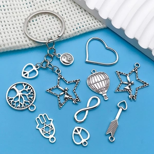 Detailed set of antique silver alloy charms featuring hot air balloons and hamsa hand for DIY