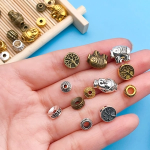 Macro detail of mixed alloy spacer beads for DIY jewelry making in various vintage shapes