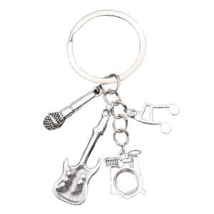 Silver metal music keychain featuring electric guitar, drum kit, microphone and music note