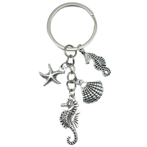 Silver marine keychain featuring seahorse, starfish and seashell charms in zinc alloy
