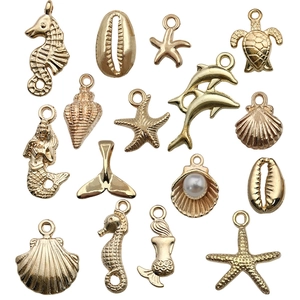 15-piece KC gold ocean animal charm set with starfish, seahorse and pearl shell for DIY jewelry