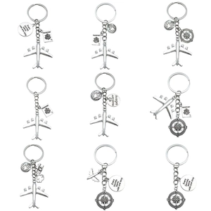 Set of 9 aviation travel keychains with airplane, compass and passport charms