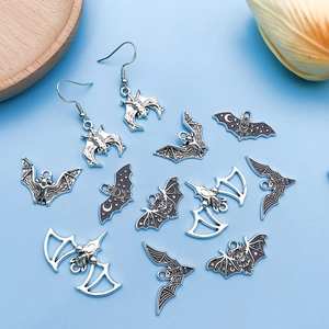 Set of 12 silver bat pendants for Halloween jewelry making and DIY necklace crafts