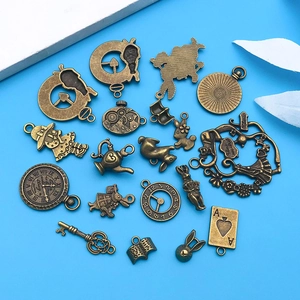 Vintage Alice in Wonderland bronze alloy charms featuring rabbits, clocks, and tea pots