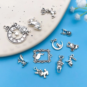 Macro shot of antique silver Alice in Wonderland rabbit charms for DIY jewelry making