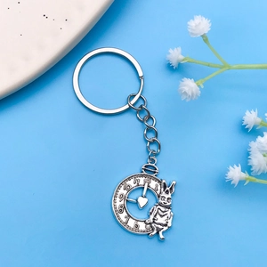 Detailed macro view of vintage silver rabbit and pocket watch charm for DIY jewelry making