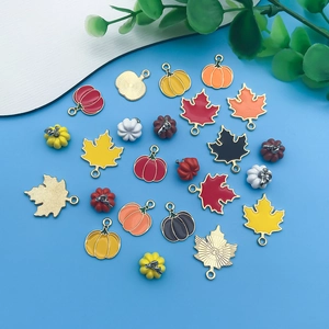 Enamel fall pendants set featuring pumpkin and maple leaf charms for jewelry making