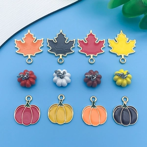 Autumn collection of 12 enamel maple leaf and pumpkin pendants for DIY jewelry crafting