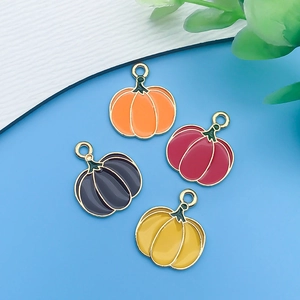 Detail view of colorful pumpkin charms for Halloween jewelry DIY crafts and bracelets