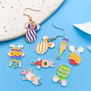 Macro detail of Easter enamel pendants featuring cute gnomes and colorful eggs