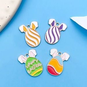 Detailed view of colorful enamel Easter egg pendants with bunny ears and holiday greetings