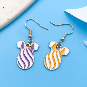 Detail of Easter bunny egg earrings with colorful enamel stripes and golden metal hooks