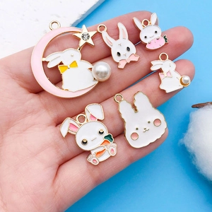 Detail showing 6 assorted Easter bunny charms with oil-drop finish and faux pearls