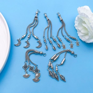 Ethnic antique silver pendants with long tassels in leaf, fan, moon and rose flower designs