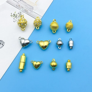 Macro view of assorted heart and cylinder magnetic clasps for DIY jewelry making