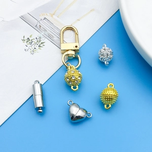 Detail of assorted heart and cylinder magnetic jewelry clasps with rhinestone accents