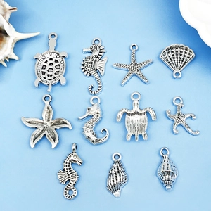 Antique silver ocean charms collection featuring sea turtles and starfish for DIY jewelry